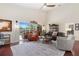 Open living room with high ceilings, hardwood floors, and sliding glass doors to the backyard patio at 17503 Edinburgh Dr, Tampa, FL 33647