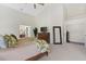 Spacious main bedroom featuring high ceilings, a leafy view, and a doorway to the closet at 17503 Edinburgh Dr, Tampa, FL 33647