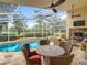 Enclosed pool area with seating, ceiling fans and a covered lanai that is great for outdoor living at 17503 Edinburgh Dr, Tampa, FL 33647