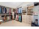 Large walk-in closet featuring built-in shelving and clothes racks at 17503 Edinburgh Dr, Tampa, FL 33647