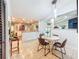 Dining area adjacent to the kitchen with modern pendant lighting and table with four chairs at 19032 Duncan Ct, Dade City, FL 33523