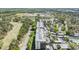 Aerial view of a condominium complex and the lush green golf course next to it at 2700 Cove Cay Dr # 5-G, Clearwater, FL 33760