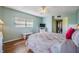 Inviting bedroom with hardwood flooring, a comfortable bed, and soft, natural lighting, creating a calming atmosphere at 2700 Cove Cay Dr # 5-G, Clearwater, FL 33760