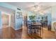 Dining area featuring hardwood floors and view into the kitchen with stainless appliances at 2700 Cove Cay Dr # 5-G, Clearwater, FL 33760