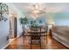 Cozy dining room features a round table with seating for four, complemented by a mirrored wall, and adjacent kitchen view at 2700 Cove Cay Dr # 5-G, Clearwater, FL 33760