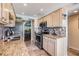 Kitchen with stainless steel appliances, granite counters, tile floors, and views of the dining area at 2700 Cove Cay Dr # 5-G, Clearwater, FL 33760