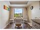 Cozy kitchen nook with a round table and chairs, next to a window and the kitchen at 2700 Cove Cay Dr # 5-G, Clearwater, FL 33760