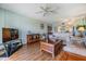 Inviting living room featuring wood floors, ceiling fan, and a furniture arrangement that is perfect for entertaining and relaxation at 2700 Cove Cay Dr # 5-G, Clearwater, FL 33760