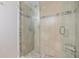 Glass shower with tile surround and built-in storage at 2700 Cove Cay Dr # 5-G, Clearwater, FL 33760