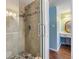 Glass shower with a tile surround next to the vanity at 2700 Cove Cay Dr # 5-G, Clearwater, FL 33760