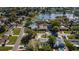Aerial view of a residential neighborhood featuring well-maintained homes and a serene lake at 2736 45Th N Way, St Petersburg, FL 33713