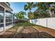 Spacious backyard with a white fence, providing a blank canvas for outdoor enjoyment and recreation at 2736 45Th N Way, St Petersburg, FL 33713