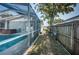 Backyard with a screened pool and hot tub, fenced for privacy at 2736 45Th N Way, St Petersburg, FL 33713