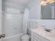 Bathroom features a tub with shower, a geometric shower curtain, and vanity with sink at 2736 45Th N Way, St Petersburg, FL 33713