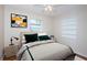 Bright bedroom featuring neutral tones, a ceiling fan, and a comfortable queen-sized bed at 2736 45Th N Way, St Petersburg, FL 33713