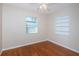 Bright bedroom features hardwood floors, a window, and a built-in shelving unit at 2736 45Th N Way, St Petersburg, FL 33713