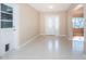 Inviting foyer with tiled flooring, decorative front door and views of the living space at 2736 45Th N Way, St Petersburg, FL 33713