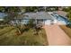 Charming single-story home with a well-manicured lawn and mature trees providing curb appeal at 2736 45Th N Way, St Petersburg, FL 33713