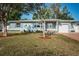 Charming single-story home with a well-manicured lawn, attractive curb appeal, and welcoming front porch at 2736 45Th N Way, St Petersburg, FL 33713