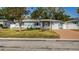 Charming one-story home with a manicured lawn, complemented by mature trees and tidy landscaping at 2736 45Th N Way, St Petersburg, FL 33713