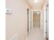 Hallway featuring access to bedroom, bathroom and thermostat for temperature control at 2736 45Th N Way, St Petersburg, FL 33713