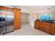 Spacious kitchen featuring wood cabinets, stainless steel appliances, and a convenient breakfast bar at 2736 45Th N Way, St Petersburg, FL 33713