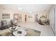 Spacious living room with tile flooring, ceiling fans, and french doors at 2736 45Th N Way, St Petersburg, FL 33713