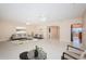 Spacious living room boasts an open layout with large windows, ceiling fans and tile floors at 2736 45Th N Way, St Petersburg, FL 33713