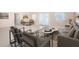 Spacious living room boasts an open layout with tile floors, large windows, and a ceiling fan at 2736 45Th N Way, St Petersburg, FL 33713