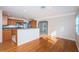 Bright living room with hardwood floors seamlessly connecting to the open kitchen space at 2736 45Th N Way, St Petersburg, FL 33713