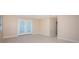 Tiled living room with French doors to the backyard, a ceiling fan, and an adjacent closet at 2736 45Th N Way, St Petersburg, FL 33713
