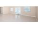 Bright, open living room with tile floors and sliding glass doors at 2736 45Th N Way, St Petersburg, FL 33713
