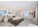 Large main bedroom with a ceiling fan, neutral walls, and French doors to the backyard at 2736 45Th N Way, St Petersburg, FL 33713