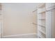 Walk-in closet complete with shelving and clothes rods at 2736 45Th N Way, St Petersburg, FL 33713