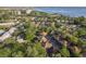 High aerial view of a residential community featuring lush trees and manicured landscaping at 2934 Lichen Ln # D, Clearwater, FL 33760
