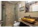 Modern bathroom with tiled walk-in shower and stone vessel sink at 2934 Lichen Ln # D, Clearwater, FL 33760