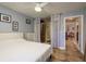 Bedroom features tile flooring, ceiling fan and closet access to Primary bath at 2934 Lichen Ln # D, Clearwater, FL 33760