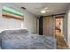 Bedroom with tile flooring, ceiling fan, and closet with sliding barn door at 2934 Lichen Ln # D, Clearwater, FL 33760