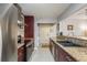 Updated kitchen features granite counters, stainless steel appliances, and eat-in bar area at 2934 Lichen Ln # D, Clearwater, FL 33760