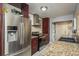 Updated kitchen featuring stainless steel appliances, granite counters, and a stacked washer/dryer at 2934 Lichen Ln # D, Clearwater, FL 33760