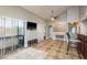 Open-concept living room with tiled floors, sliding glass doors to a balcony, and vaulted ceilings at 2934 Lichen Ln # D, Clearwater, FL 33760