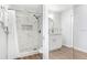 Updated bathroom with tiled shower, modern fixtures, and glass shower door at 303 Cranston Pl, Sun City Center, FL 33573