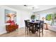 Dining room with stylish decor, wood-look flooring, and bright natural light at 303 Cranston Pl, Sun City Center, FL 33573