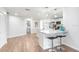 Modern kitchen featuring white cabinets, granite countertops, and breakfast bar at 303 Cranston Pl, Sun City Center, FL 33573