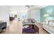 Open-concept living room with tile floors and comfortable seating area at 303 Cranston Pl, Sun City Center, FL 33573