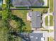 Birds eye view of the residence, highlighting the backyard space, surrounding greenery, and neighborhood at 3310 W Swann Ave, Tampa, FL 33609