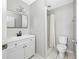 Clean bathroom with white vanity and tiled shower at 3310 W Swann Ave, Tampa, FL 33609