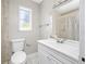 Clean bathroom features a white vanity, tile floors, and a shower-tub combination at 3310 W Swann Ave, Tampa, FL 33609