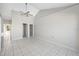 Large bedroom with modern fan and an en suite bathroom at 3310 W Swann Ave, Tampa, FL 33609