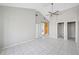 Spacious bedroom features modern fan and ensuite bathroom access at 3310 W Swann Ave, Tampa, FL 33609